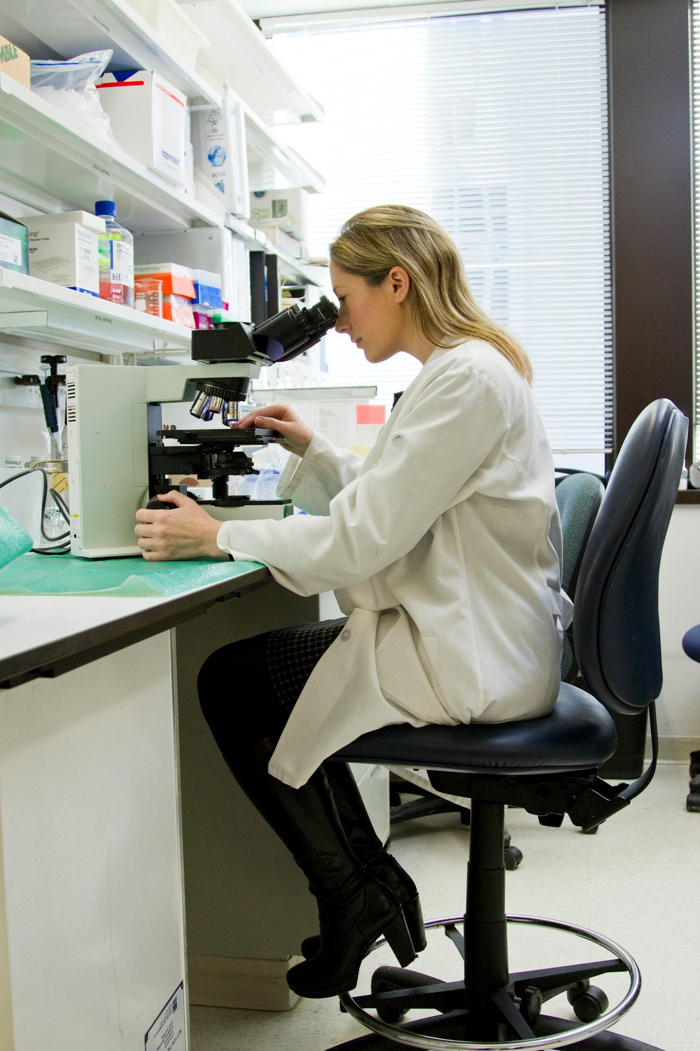 Scientist working at a microscope
